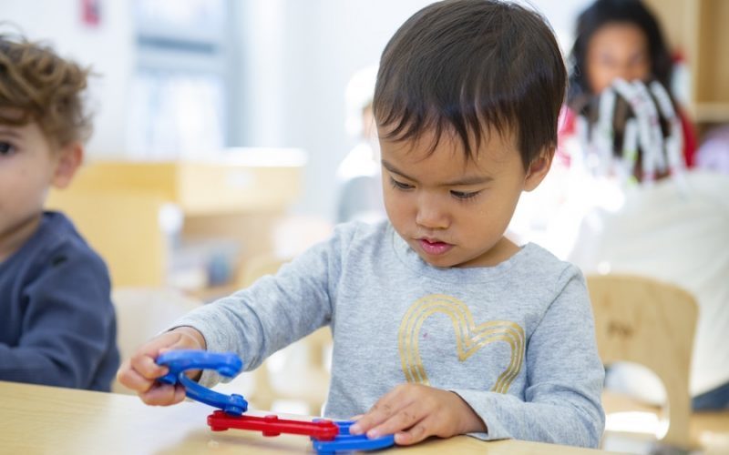 child concentrating while playing