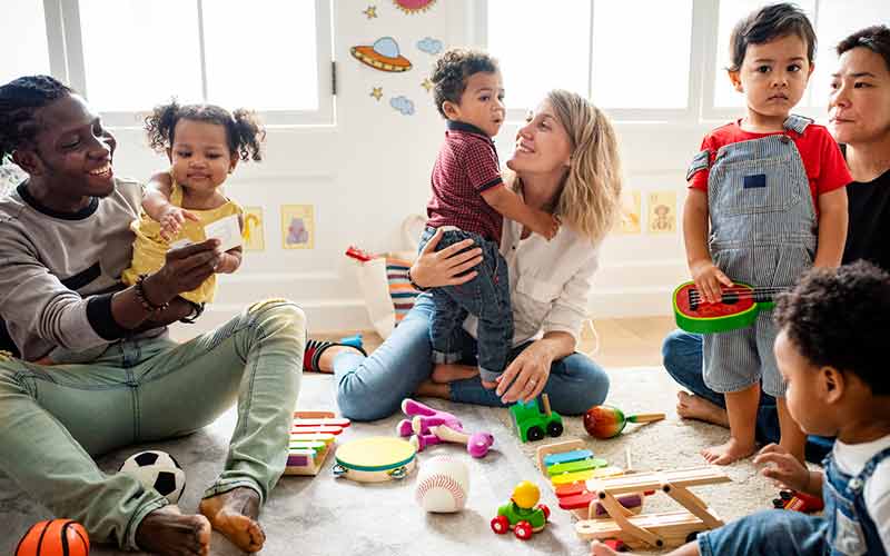 Parent at preschool with children