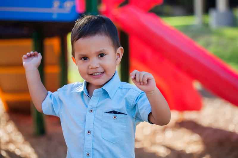 young toddler cheering