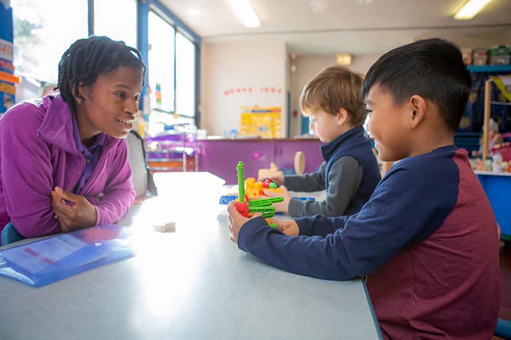 image of teacher and student smiling